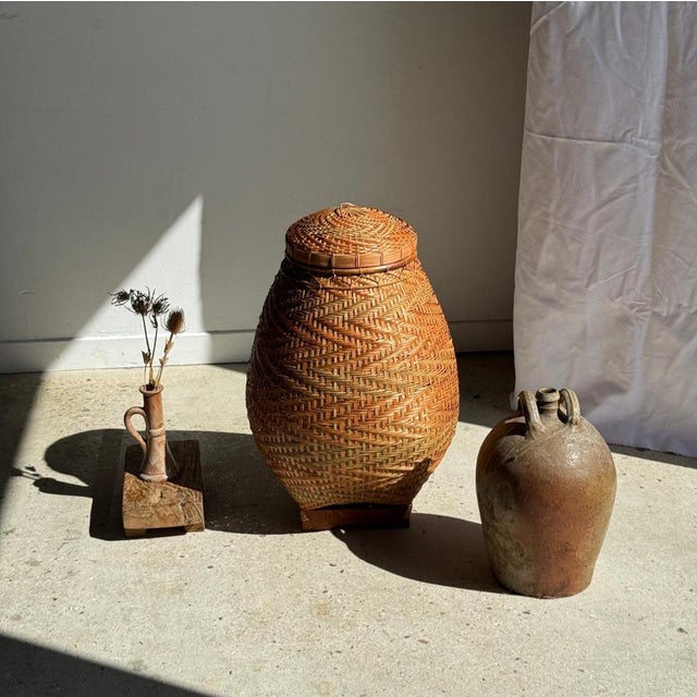 Large oval-shaped Indonesian wicker basket with a lid. Total height: 65cm, maximum width: 50cm, opening diameter: 26cm,...