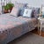 The Aizel hand stitched quilt features a patchwork assortment of soft, yet vibrant hand block printed floral designs in...
