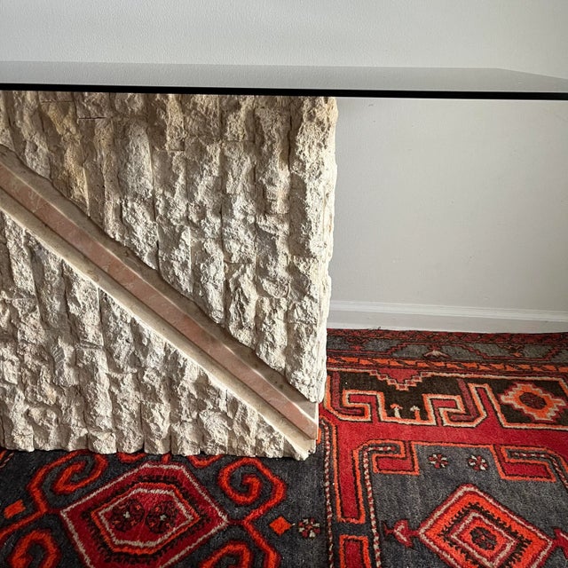 Vintage Postmodern Natural Mactan Stone Console /Sofa Table. Circa 1980s rectangular Smoke glass rests on Mactan Stone...