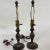 Pair of reproduction Art Nouveau style lamps made from metal with a patinated bronze finish. Both lamps are in working...