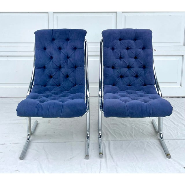 Here is a fantastic pair of upholstered, curved chairs with modern chrome bases. The upholstery is a wonderful blue that...
