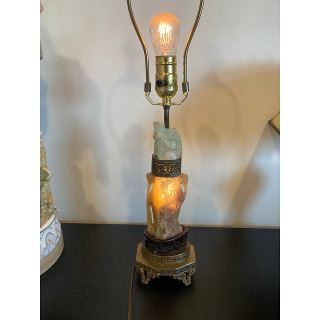 Very nice lamp. I’m guessing the carved stone is either quartz or nephrite or a combination of both. Has been rewired for...