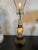 Very nice lamp. I’m guessing the carved stone is either quartz or nephrite or a combination of both. Has been rewired for...