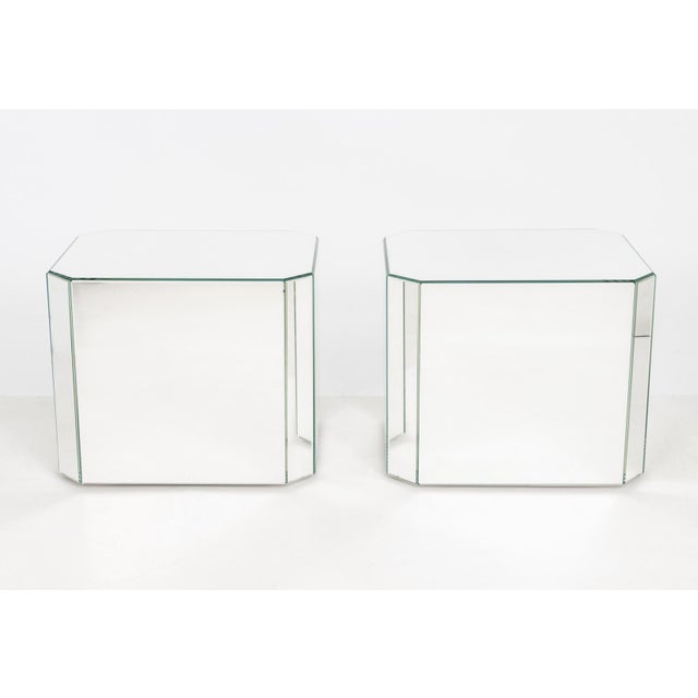 Pair of Modern Mirrored Pedestal Tables, rectangular with canted corners, the mirror panels with beveled edges. 23" H x...