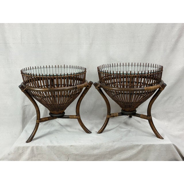 A rare pair of Franco Albini “fish trap” tables, Italy, 1950s, each retaining its original glass top — individually fitted...