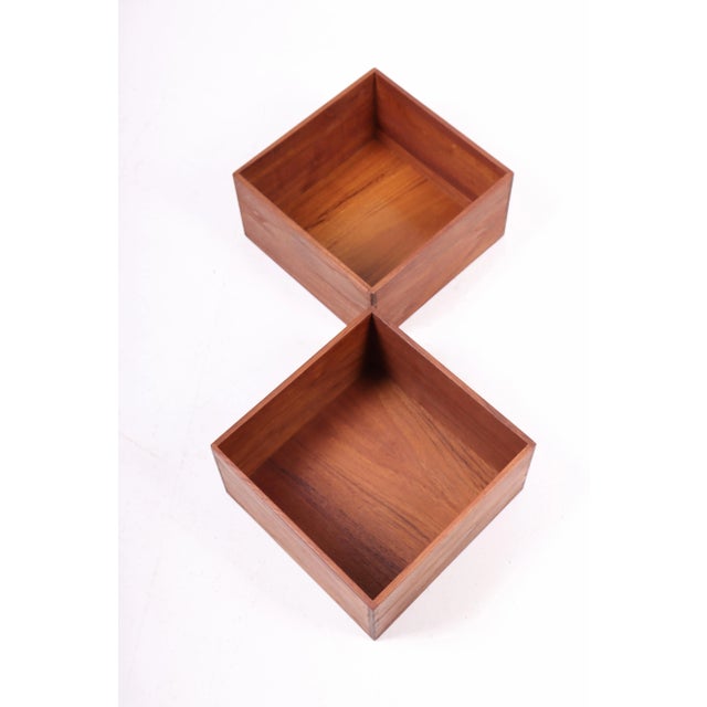 Pair wall-mounted bookcases in solid teak. Designed and made in Denmark. Great original condition.