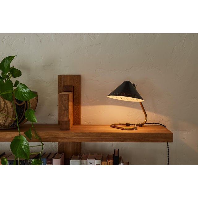 Pair of 1950s Erik Warna 'GK14' Black and Brass Perforated Shade Table Lamps. Executed in perforated black painted metal...