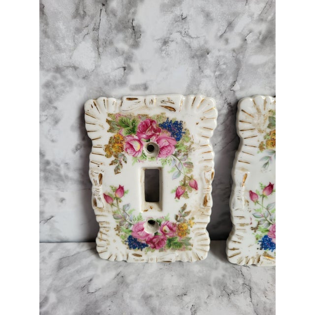 Ideal for a bedroom or bath, these porcelain light switch covers offer a vintage charm. They are hand painted with pink...