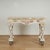 Impressive grotto style Italian console table featuring a scalloped marble veneer top over a classical form base with...