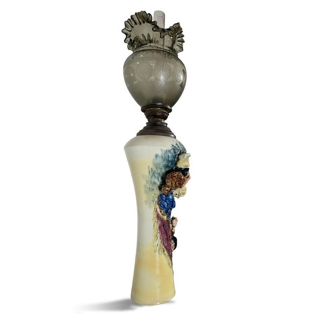 This striking glazed ceramic figural oil lamp, produced in Italy between the late 19th and early 20th century, stands out...