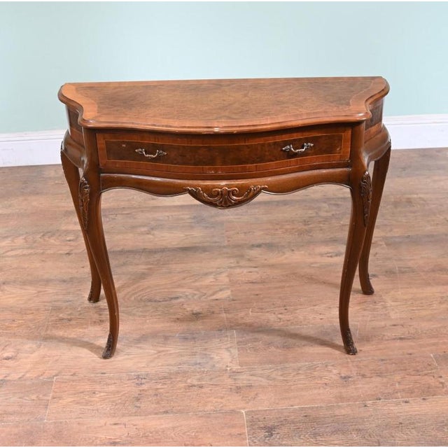 A Queen Anne style side table or server in burr walnut with satinwood crossbanding around the top and drawer front Clean...