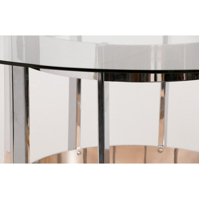 A striking example of British mid-century modern design, this round dining table was designed by Richard Young for Merrow...