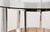 A striking example of British mid-century modern design, this round dining table was designed by Richard Young for Merrow...