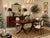 Beautiful vintage dining table by Baker Furniture, crafted in rich mahogany in an elegant Georgian style. Features a...