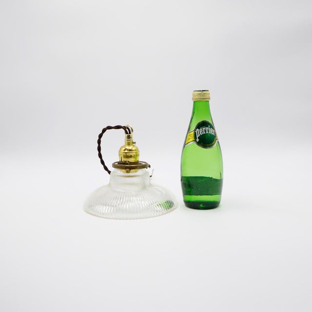 We offer this Holophane Clear Glass Vintage Industrial Pendant Light. Prismatic glass shades in excellent condition. The...