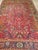 "An extraordinary and rare early 20th century Persian Heriz Serapi rug featuring a vibrant allover geometric design that...