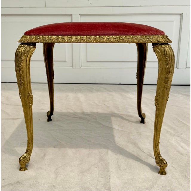 Here is a stunning, ornate brass bench/stool made in the Louis XVI, Rocco, Baroque design styles. The piece features...