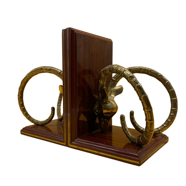 This striking pair of vintage ram head bookends blends Art Deco glamour with neoclassical symbolism, resulting in a...
