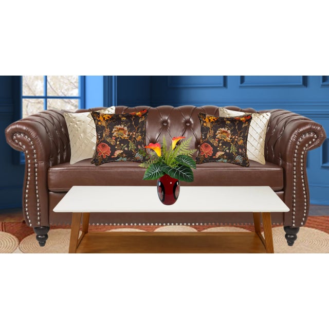 Elevate your decor with this captivating ovoid-shaped art glass vase. Its sleek design includes a smooth lip and a cased...