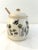 Charming ceramic lidded honey pot with bumble bee and floral motif around perimeter. Wood dowl stirrer included. Excellent...