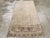 A vintage Turkish Oushak accent rug. This long Turkish scatter may have been woven closer to central Anatolia. The colors...
