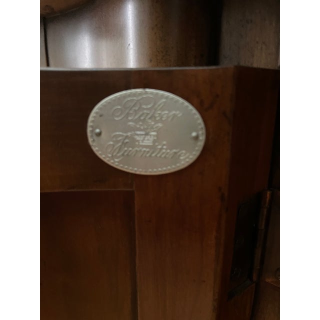 Baker demilune console table or bar cabinet. 2 cylindrical doors. Original lock and key with the brass hardware. The...