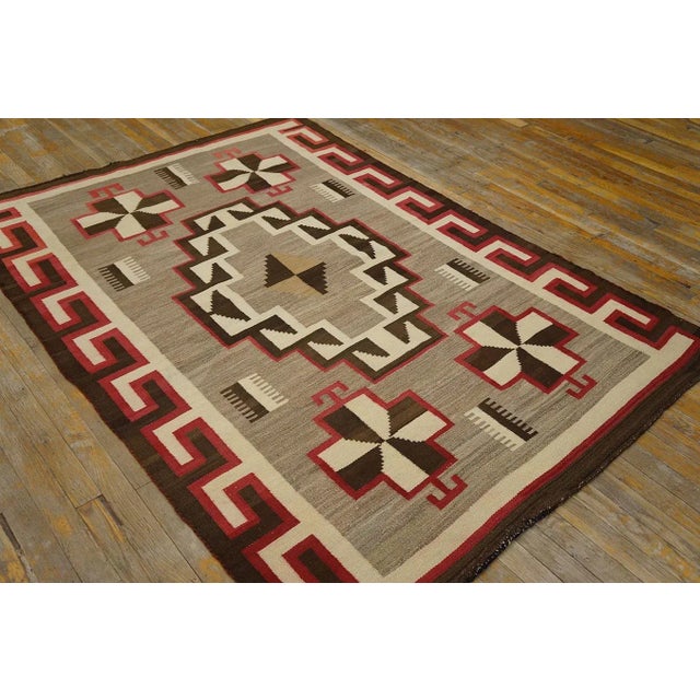 1920s Navajo Rug ( 4' 6" x 6' 6" - 137 x 198 ) Antique Wool Gray Flat Weave Rug, Circa Date: 1925. This exceptional...