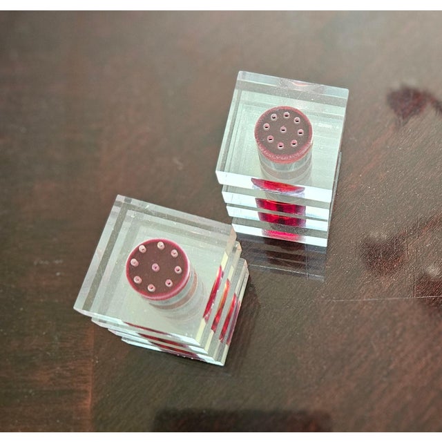 Vintage red and clear salt and pepper shakers with an art deco mid-century design. Featuring a "stepped" or tiered square...