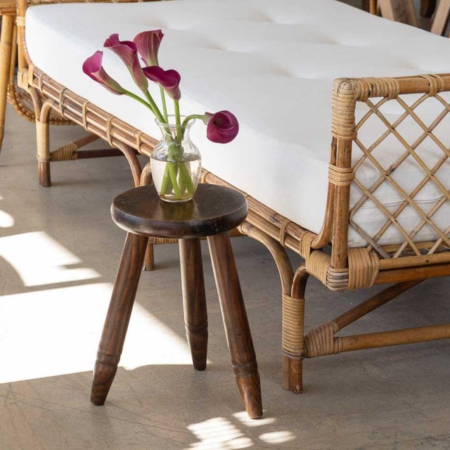 Vintage wood tripod stool from France. Circular top and smooth wood legs with two-ring groove detail. Original finish...