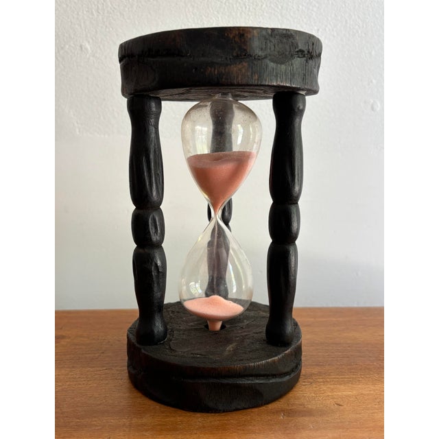 Rustic carved wood and glass hourglass with pink sand. Most items found at Pub & Oasis are vintage and antique in nature...