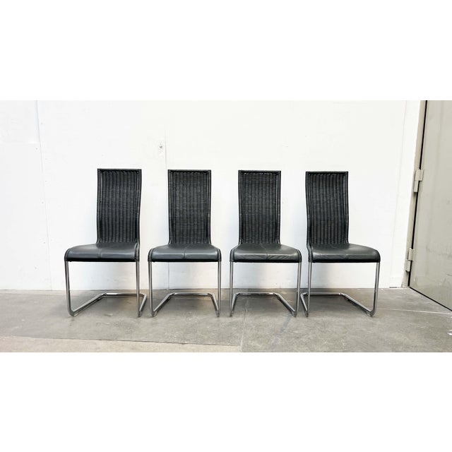 Four classic Tecta cantilever chairs in a rare color with matching leather cushions. Classic tubular steel cantilever...