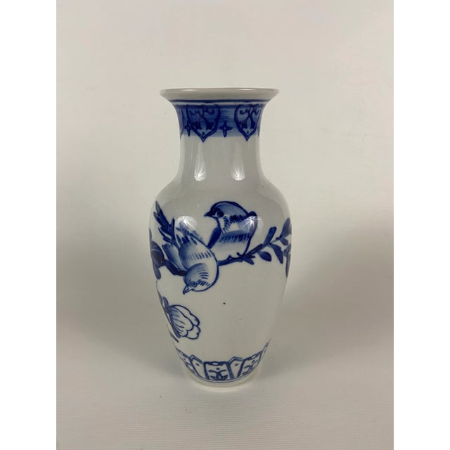 Round Chinese export porcelain vase with hand painted blue floral decoration and birds.