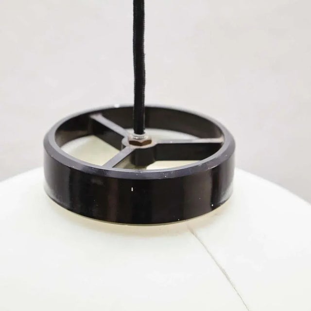 A set of three pending lamps of different sizes designed by miguel milá, circa 1970. Manufactured by tramo (spain). In...