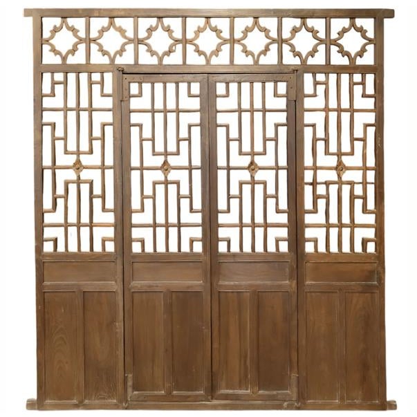 This antique panel is handmade from solid elm and retrieved from Shanxi province. It features intricate geometric lattice...