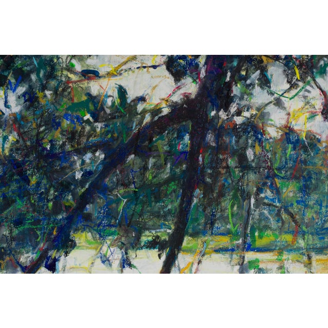 This pastel on board artwork captures a serene landscape, featuring a lush interplay of foliage and water. The vibrant...