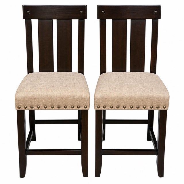 Set of two counter height stools featuring a dark wood frame, slat back design, and neutral upholstered seats with...