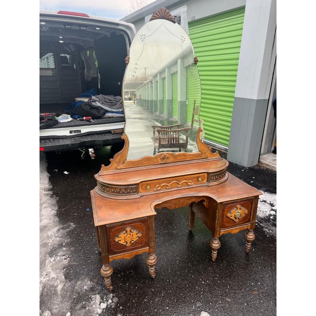 This authentic antique Victorian vanity dates to the late 19th century and showcases the rich ornamentation and...