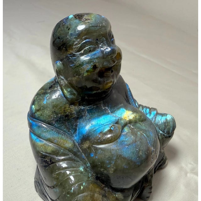 This vintage hand carved Buddha sculpture is carved out of natural Labradorite crystal stone, making it a unique and...