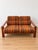 Vintage Scandinavian living room set from the 1970s, comprising a two-seater sofa and a matching armchair. This set exudes...