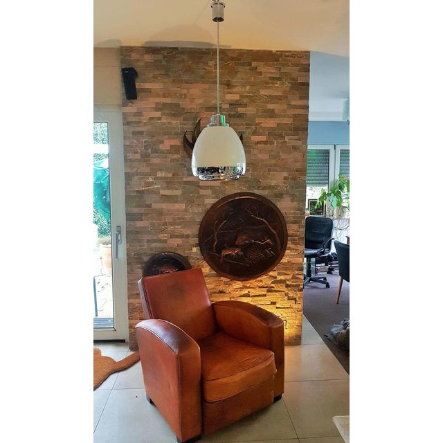 Mid-century pendant lamp by Pia Guidetti Crippa for Lumi in the 1960s. An impressive luminaire made of opal glass with...