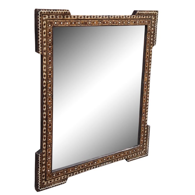 An exquisite mid 20th century Syrian mirror showcasing traditional mosaic inlay craftsmanship. The wooden frame is...