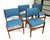 A set of four very well -crafted Mid Century teak wood framed dining chairs with tight woven blue toned contract fabric by...