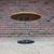 This is an iconic Noguchi for Knoll cyclone dining table with a 36” white laminate top. The black cast iron base contrasts...