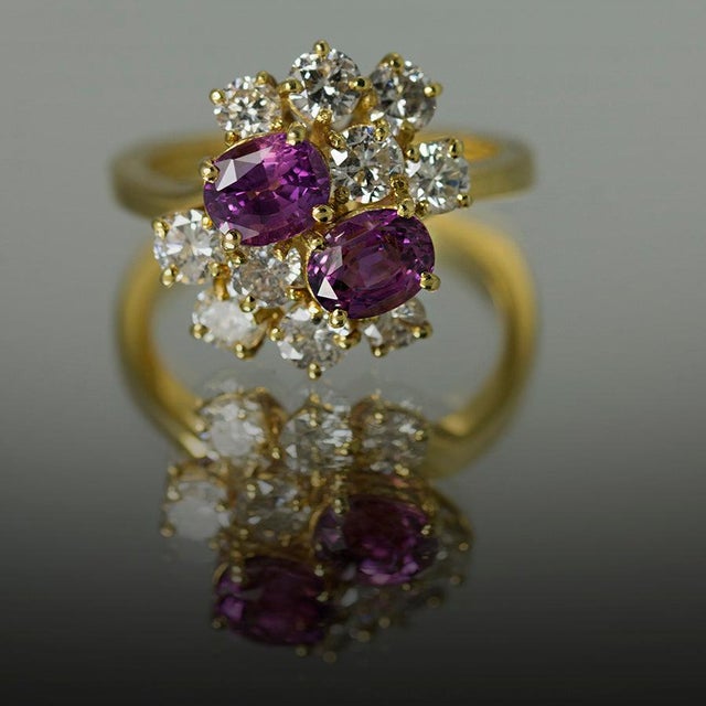 18k Hand fabricated ring by Keith Davis with 2 pink sapphires weighing 2.16 carats and 10 round diamonds weighing 1.51...