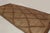 This vintage Moroccan mat is a primitive 9x20 Tuareg work from the nomadic tribe of the same name. Handwoven with reeds...