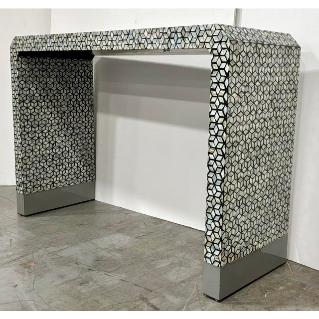 Stylish Modern Mother of Pearl Waterfall Console Table, silver metal feet, showroom floor sample