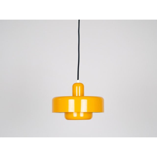 A pair of Danish aluminum Vitrika lamps. The lamp's form is based on the principle of a reflective system that directs...