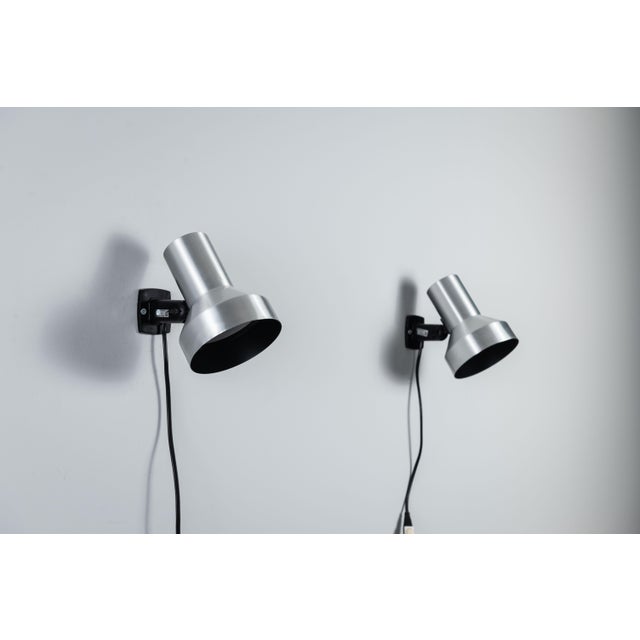 This pair of vintage adjustable wall lamps, produced by the Swedish lighting company Belid, showcases the brand’s refined...