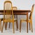 Vintage MCM teak solid-wood table and 4 highback dining chairs. Designed in Denmark by Benny Linden and produced in...