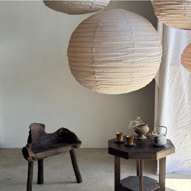Large, round, pale pink Japanese-style rattan and natural linen pendant light. Beautifully handcrafted: natural rattan and...